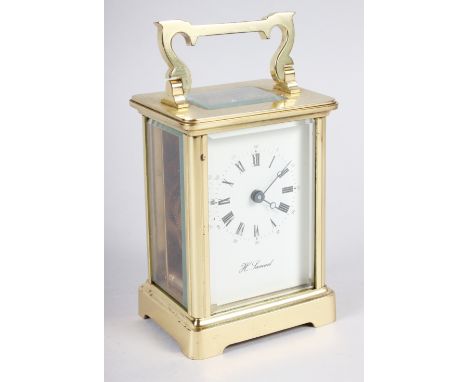 A brass cased carriage clock by H Samuel 