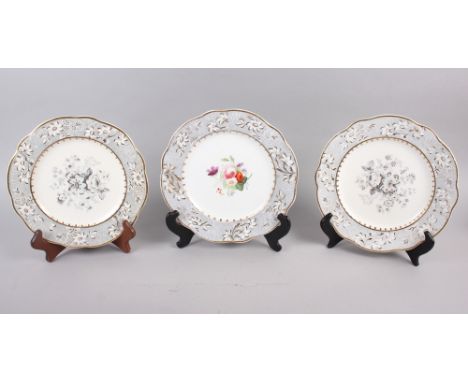 A pair of Rockingham porcelain dessert plates with grey and gilt decorated floral borders and central floral reserve, puce gr