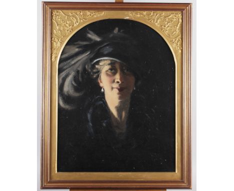 An oil on canvas portrait of a 1920s woman, 19" x 14 3/4", in gilt arch top frame Condition: No tears or paint loss