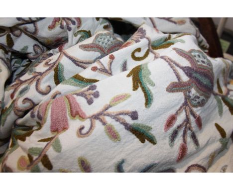 A pair of floral patterned crewel work curtains, each panel, 63" x 45" approx, and a matching larger pair of curtains, each p