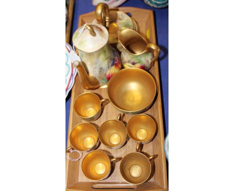 A Royal Worcester bone china fruit and gilt decorated coffee service for six, fruit painted by Rickells Condition: One cup is