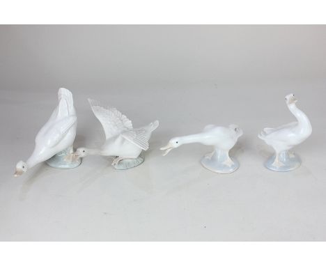 Three Lladro porcelain models of white geese in various poses, one unglazed, 8cm, together with a Nao model of a goose, 11.5c