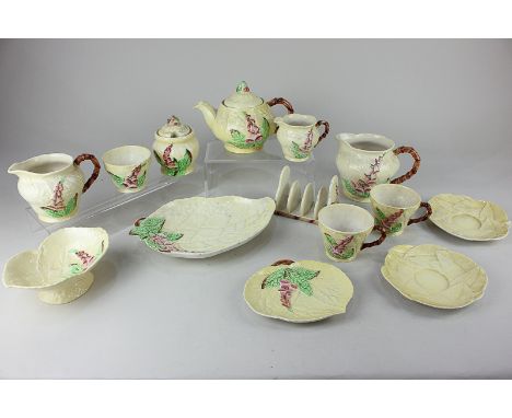 A Carlton Ware porcelain part tea and breakfast set, decorated with pink foxgloves on yellow ground with leaf effect, compris