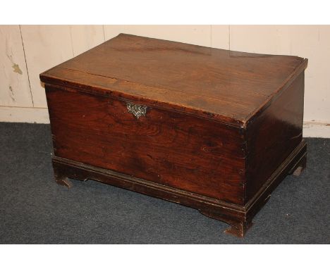 A George III possibly elm rectangular trunk, on moulded edge base and bracket feet, later repairs (a/f), 79cm