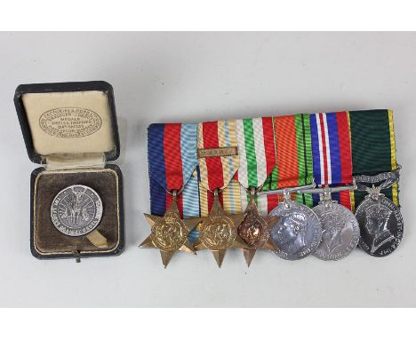A group of Second World War medals comprising a Territorial Medal for Efficient Service to 1449098 SJT T. H. A. PYKE RA, a Se