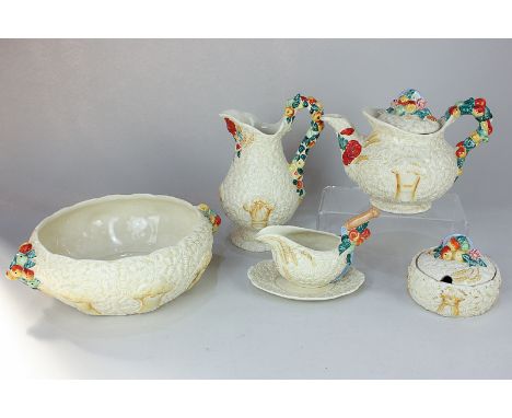 A collection of Clarice Cliff for Newport Pottery tea and tableware in Celtic Harvest pattern, comprising teapot, large jug, 