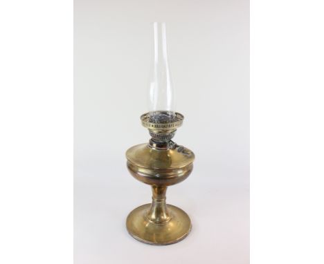 A Victorian brass oil lamp with baluster stem on circular base, 32cm, and clear glass funnel