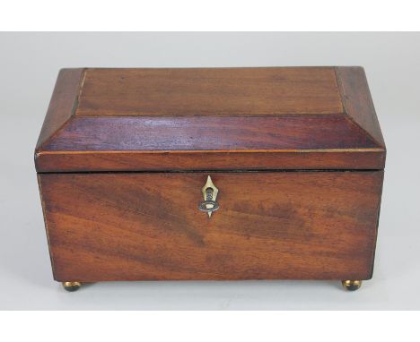 A 19th century mahogany tea caddy on ball feet, 23cm wide