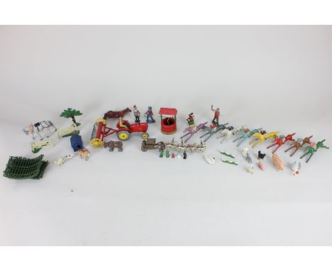 A collection of Britains and Dinky cast models, including a tractor, farm animals, well, horse-drawn carriage and racehorses 