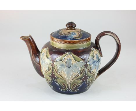 A Doulton Lambeth pottery teapot by Eliza Simmance, decorated with stylized daffodils, incised mark to base (a/f - significan