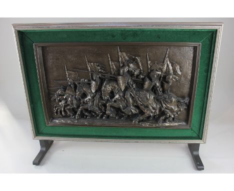 A Marcus Designs large composition plaque of knights on horseback, charging with lances, in table top display frame, 30cm by 