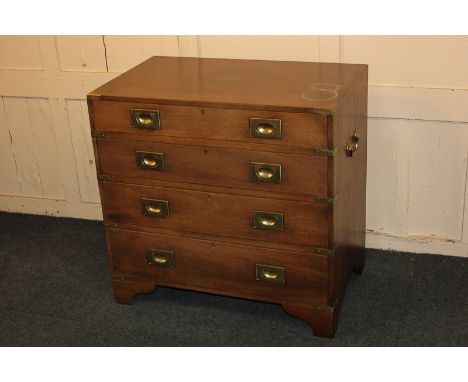 A Campaign style metal mounted chest of four drawers, with flush brass handles, and brass side handles, on bracket feet, 75.5