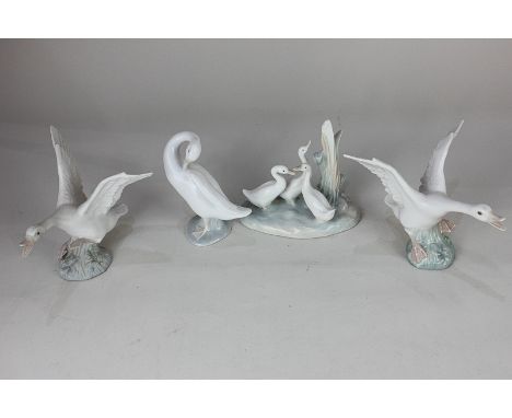 Three Lladro porcelain models of white geese in various poses one unglazed, 12cm, together with a Nao porcelain model of gees