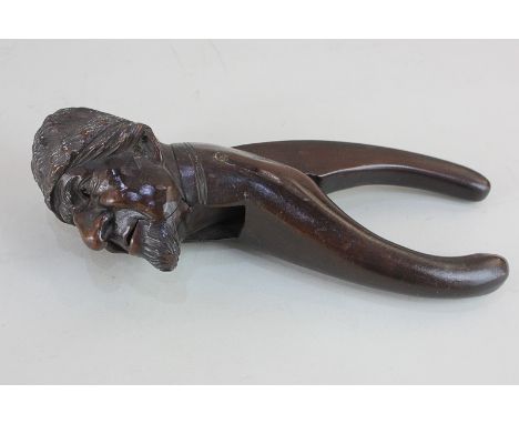A continental novelty carved wood nutcracker, in the form of a head of a bearded man, 20cm