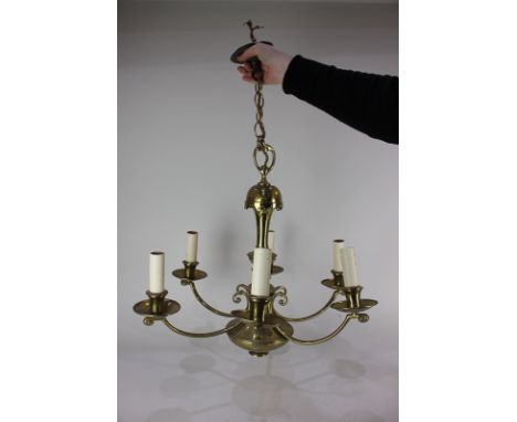 A large brass six-branch chandelier light fitting, approximately 59cm
