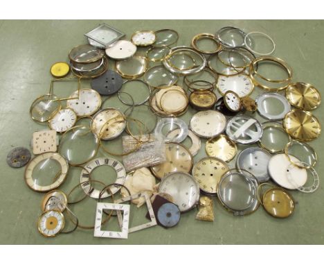 Large quantity of various mantel clock bezels and dials etc