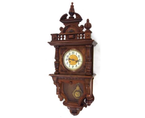 Junghans walnut two train regulator wall clock striking on a gong, the 6.25" cream chapter ring enclosing a gilded foliate ce