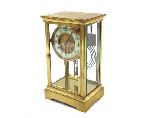 French brass four glass two train mantel clock striking on a gong, the 3.5" white chapter ring enclosing a gilded recessed ce