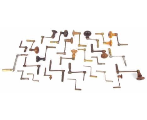 Quantity of wooden handled and other crank clock winding keys (over twenty)