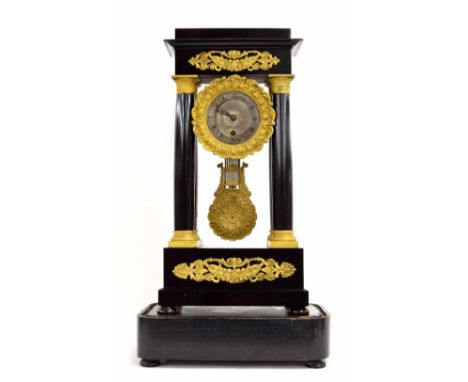 French ebonised and gilt metal mounted portico mantel clock timepiece, upon a dome base, 20.5" high overall (pendulum but no 