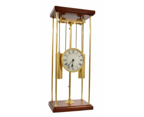 'The Rising Works Clock' created by the Franklin Mint - 1985, the 5.5" silvered dial within a mahogany and brass pillared ope