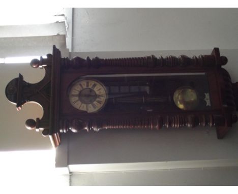 Late 19th century walnut cased Vienna wall clock, white enamel dial with Roman numerals, height 125cm