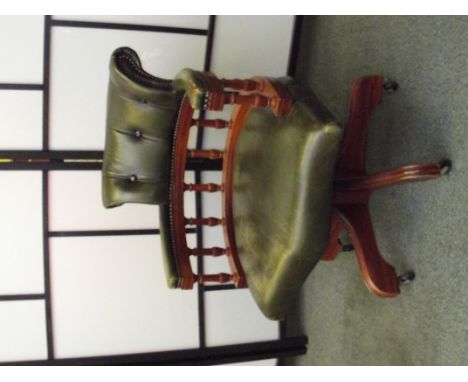 20th Century office swivel chair with button back green leather upholstery and baluster  supports, height 77cm