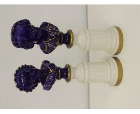 A pair of ceramic colbalt blue busts, raised in column plinths. Hight 45cm, slight hairlines on both