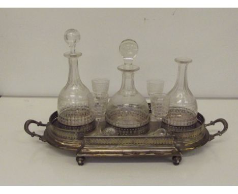 Late Victorian silver plated decanter stand, (one glass a/f and one decanter retaining original stopper) 