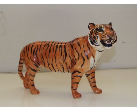 Beswick ceramic tiger 19cm high, 30 cm long. Stamped Beswick England on both front paws