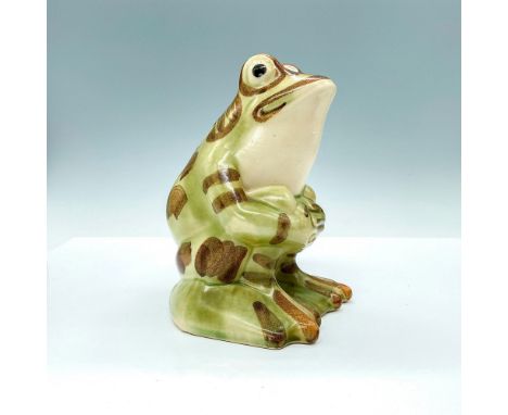 This whimsical hand painted ceramic frog was made by the Brush McCoy Pottery Company. He is seated and hugging his legs with 