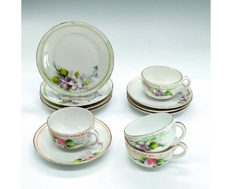 Vintage hand painted porcelain cups 2.75"L x 2.25"W x 1.25"H, saucers 0.5"H x 3.75"dia and plates 0.5"H x 4.25"dia in a flora