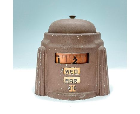 This American Art Deco clock and alarm clock, designed and patented in 1938, features an integral manual tape-measure type pe