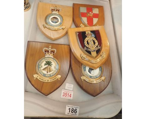 Five military insignia on wood shields including Royal Army medical crops, Royal Air Force Station, Lytham etc 