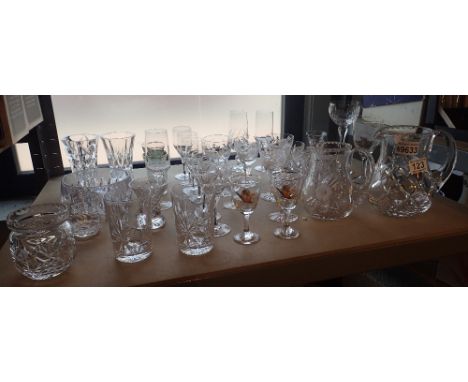 Shelf of assorted drinking glasses including crystal 