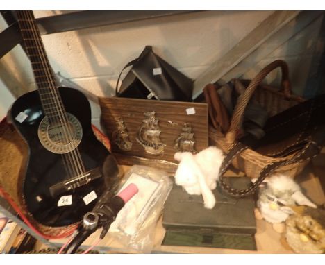 Shelf of mixed items including childs Sierra guitar, polaroid camera, wicker basket, bowling ball etc