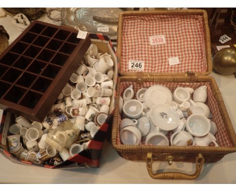 Collection of ceramic thimbles and display box and miniature picnic set in wicker hamper 
