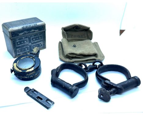 Selection of collectables includes compass, hand cuffs etc 