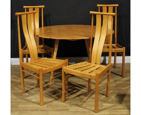 An Ercol beech and elm drop-leaf dining table, 71.5cm high, 63cm opening to 124.5cm long, 113.5cm wide; a set of four Ercol S