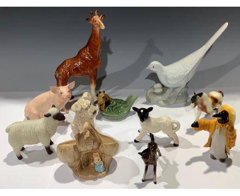 A John Beswick model of a pig; a John Beswick Penguin in a yellow mac and Sou'wester; a Melba giraffe; a Sylvac terrier; a Sp