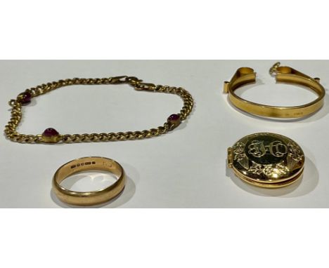 A 9ct gold wedding band, size Q, 3.16g; a 9ct gold coin mount, 4.2g; a 9ct gold and ruby bracelet, 3.9g; a gold plated oval l