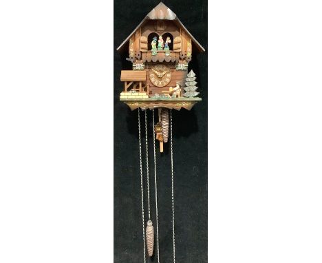 A Black Forest musical cuckoo clock, by Schneider, three weights, pendulum, instructions 
