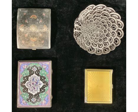 A silver engine turner cigarette case, applied with yellow engine turned enamel; two other cigarette cases; a silver filigree