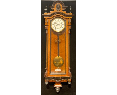 A late Victorian walnut and parcel-ebonised Vienna wall clock, 120cm high, 40cm wide 