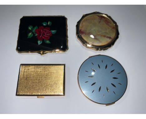 A lady's 1960s Swiss rectangular powder compact, engine turned, with internal mirror, 7.5cm; two mid-20th century Stratton po
