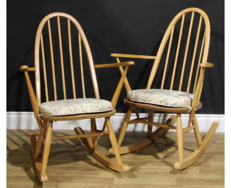 A pair of mid 20th century Ercol ‘Blonde’ Elm spindle-back rocking chairs, each 91cm high (2) 