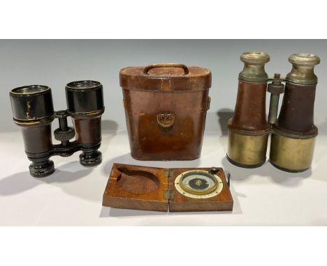 An early 20th century mahogany travelling pocket compass, Barker &amp; Son, 1918; a pair of early 20th century binoculars, le