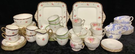 A Wedgwood part tea service, floral pattern, comprising cake plates, side plates, cream jug, sugar bowl, cups and saucers, c.