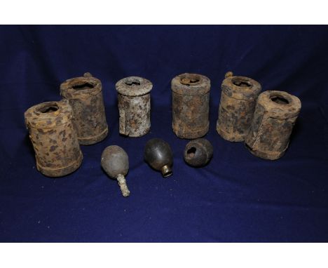 Six relic stick grenade heads and three German egg grenades 