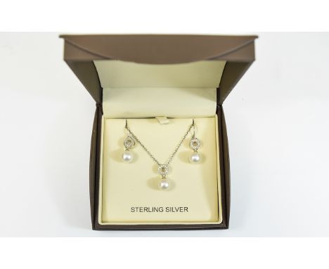 Silver Diamond Set Pendant Necklace and Earring Set. Contemporary, boxed elegant long, fine silver necklace with small circul